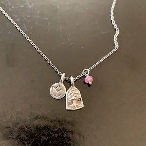 Satya sterling silver charm necklace.